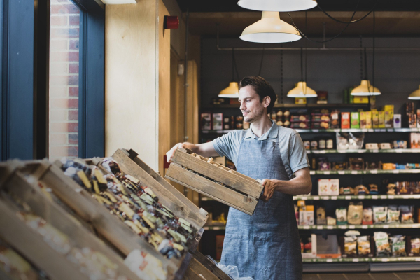 ey-small-business-owner-of-a-food-market-stocking-shelves.jpg.rendition.1800.1200