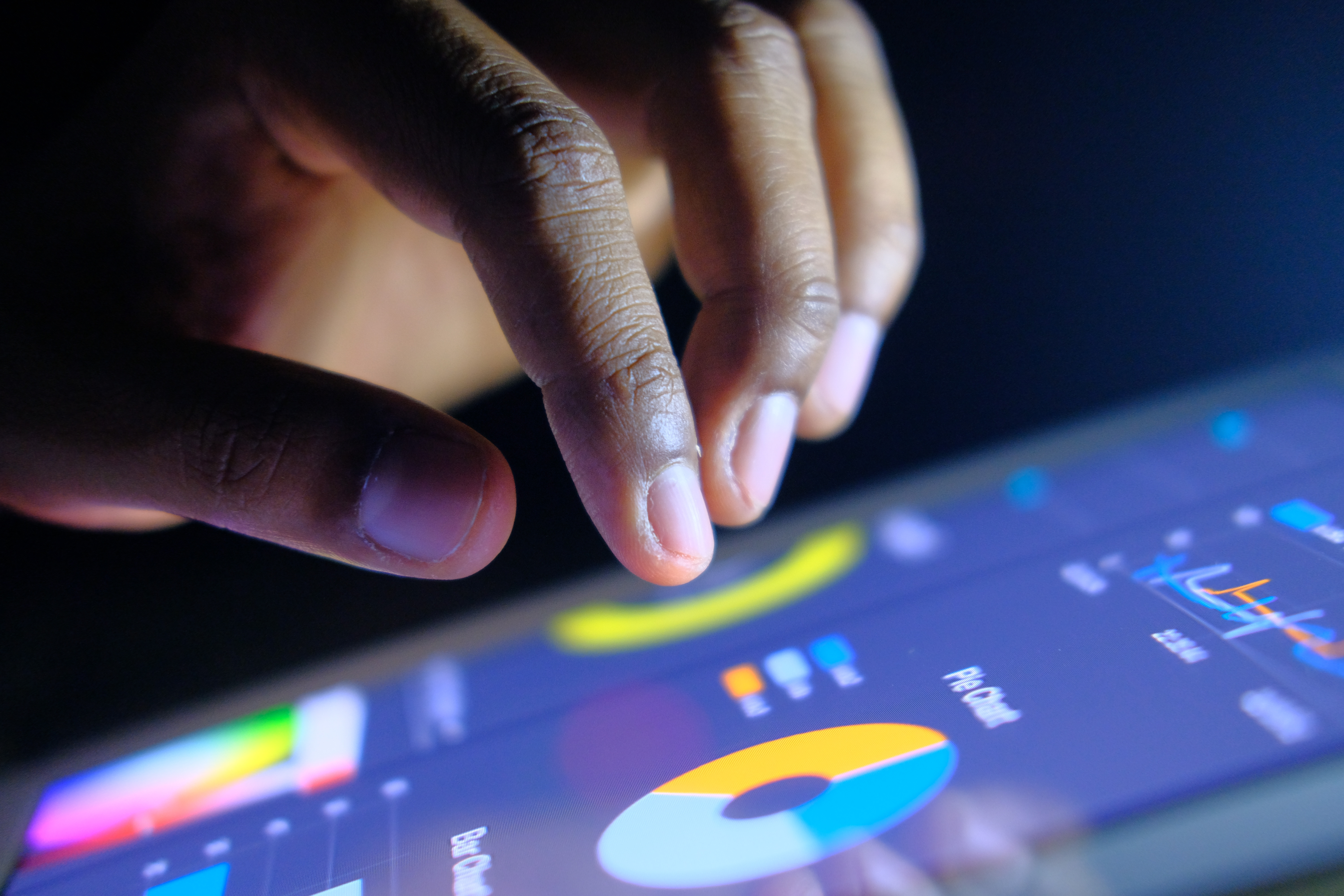 Close-up of man hands touching digital tablet with business diagram